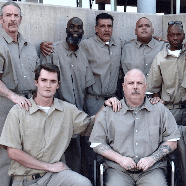 Ross (front left) is photographed with a few of his fellow inmates